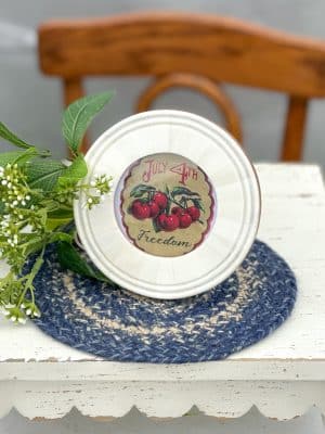 Round bone photo frame with a vintage-style “July 4th Freedom” cherry insert.